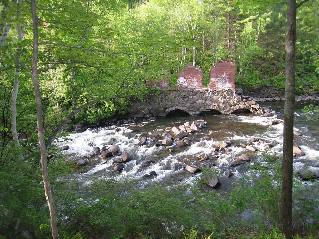 Tilton NH Rail Trail 2010 0290.jpg - Winnipesaukee River Trail, Franklin New HampshireTrestle View ParkInterested in taking a walk or bike ride on a scenic historic trail close to the downtowns of the twin rivers area, yet with the feel of wilderness. A 3 mile trail parallels the Winnipesauke river and passes the historic Sulphite upside down covered bridge believed to be the only one in the country and listed on the national register of historic places. You will also view mill ruins and remaining portions of dams that tell the history of the 5 mills that operated on this river in the mid 19th century.